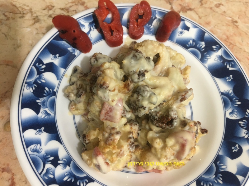 סלט כרובית צלוייה עם טחינה וגמבה על האש בתחמיץ